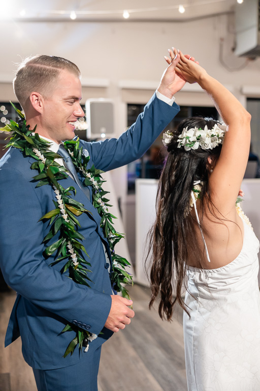 Hawaiian themed wedding newlywed dancing