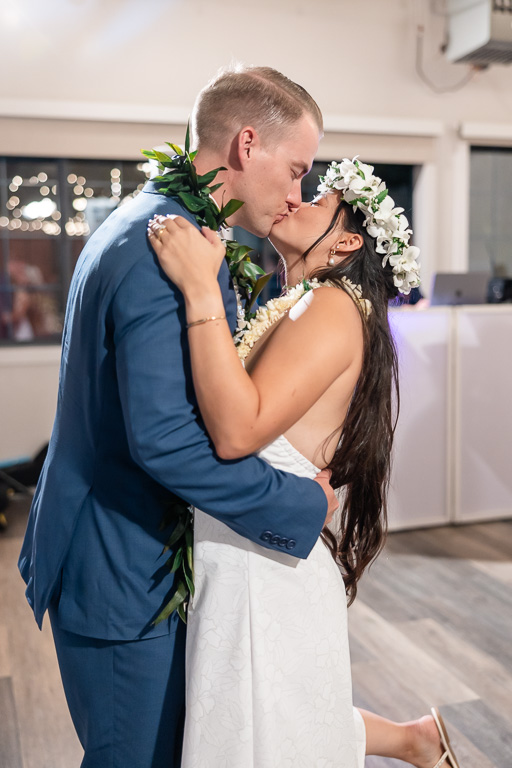 bride and groom kiss ending the reception