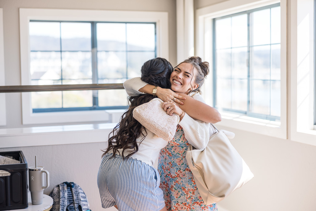 bribe hugging a friend during wedding prep