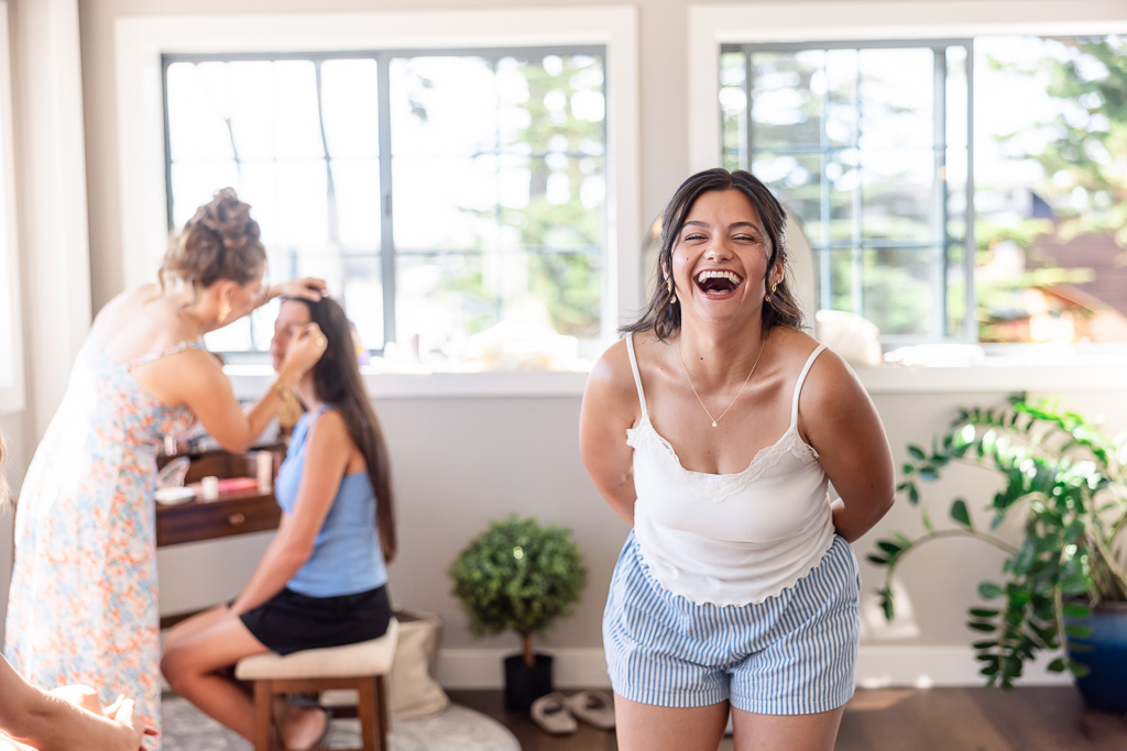 cute candid photo of the bride with her gals getting gready