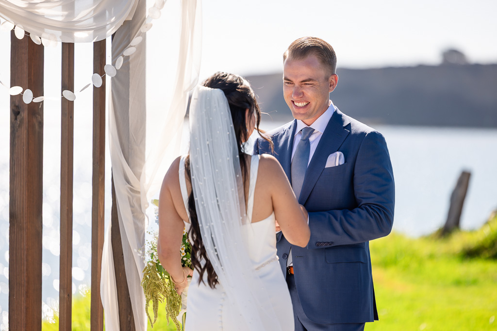 groom very happily looking on to his bride