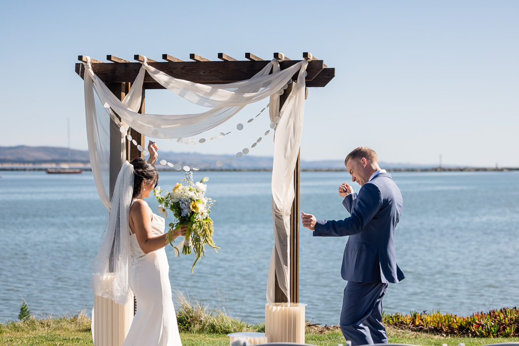 bride and groom doing a little happy dance just before their wedding