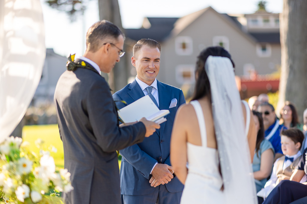 a direct shot of the groom from the side during wedding ceremony