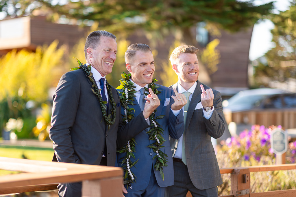groom, his brother, and their dad showing off their rings