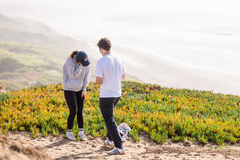 surprised reaction to proposal on cliff top