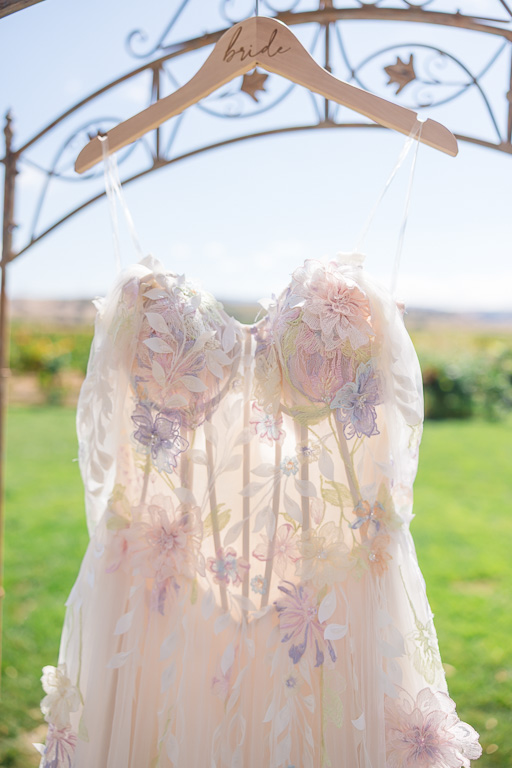 close-up of subtly colorful elegant wedding dress