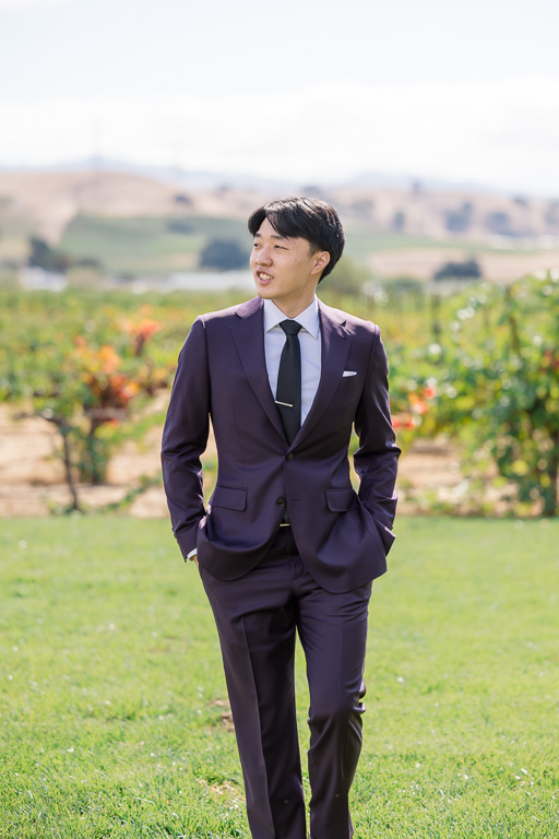 groom looking dapper all suited up in the backyard