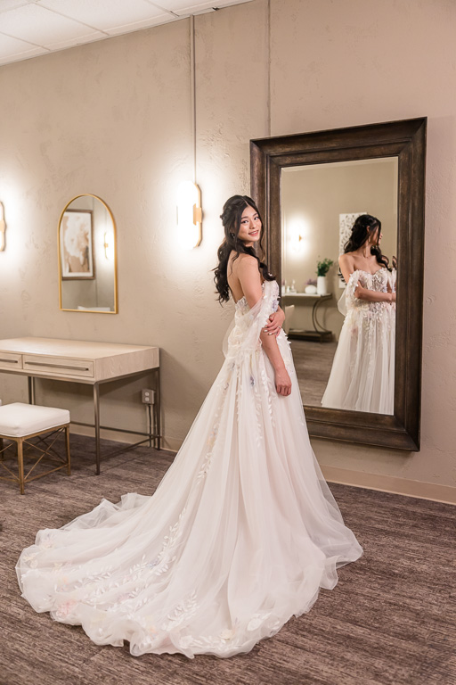 bride in front of a floor-length mirror