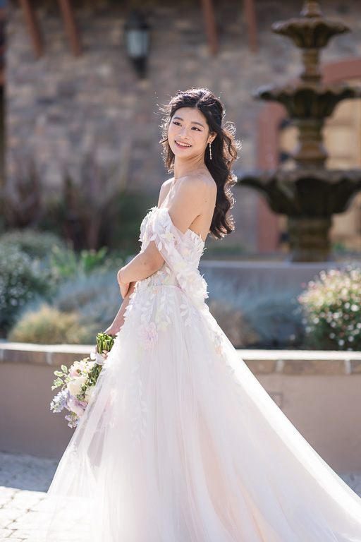 bride out in the sunlight in front of Casa Real