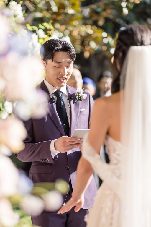 groom reading his vows to his bride at Casa Real