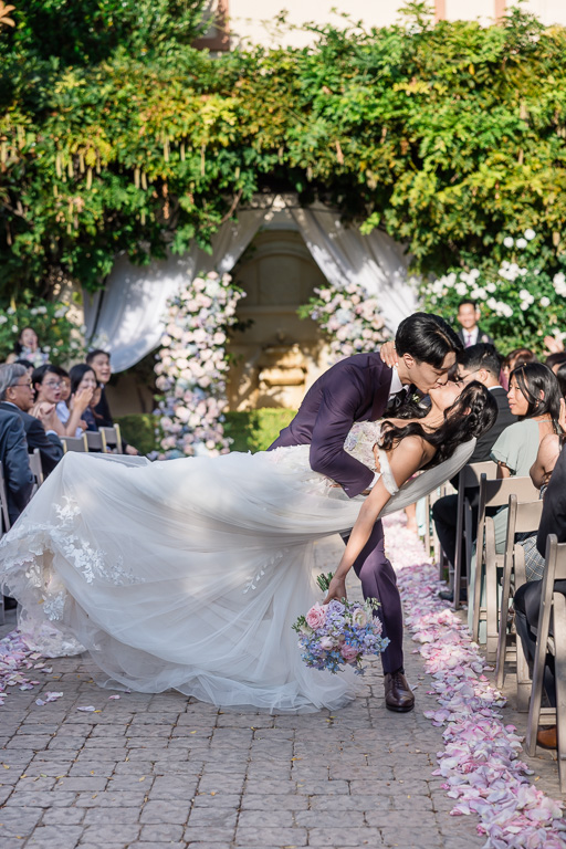 dip and kiss at the end of the aisle