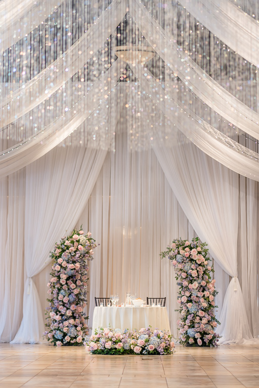 sweetheart table at Casa Real with elegant drapery