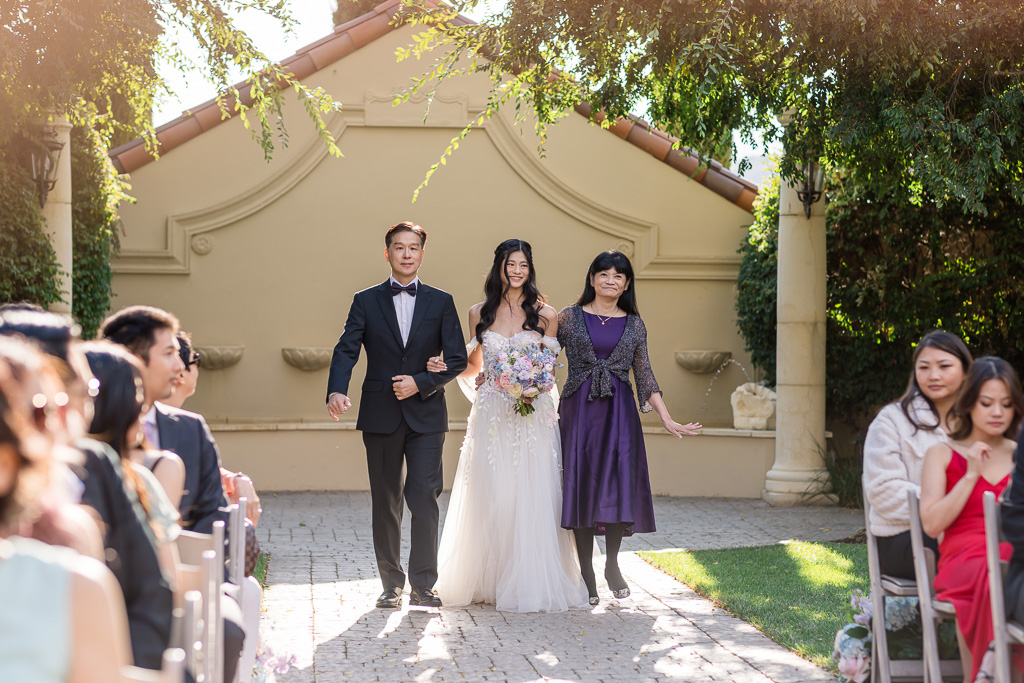 Bride walking down the aisle during ceremony processional