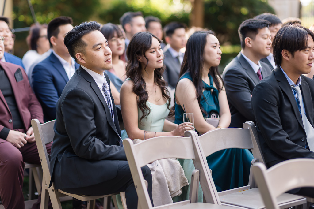 friends of the couple watching outdoor ceremony