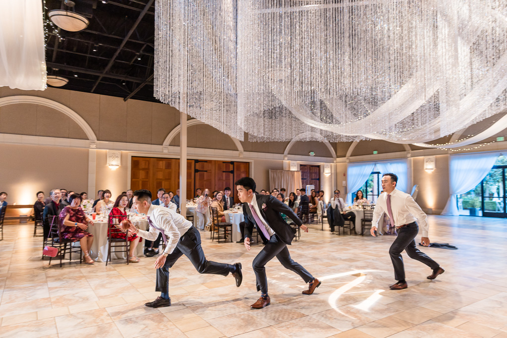 Groomsmen performing choreographed reception entrance dance