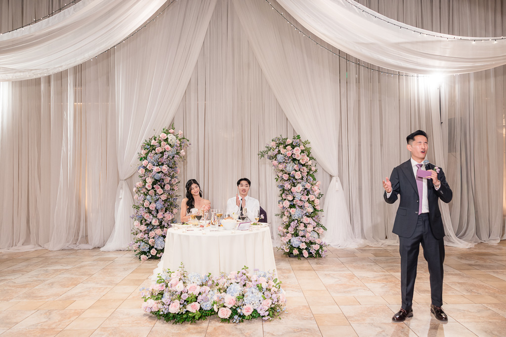 Best man giving speech at wedding reception