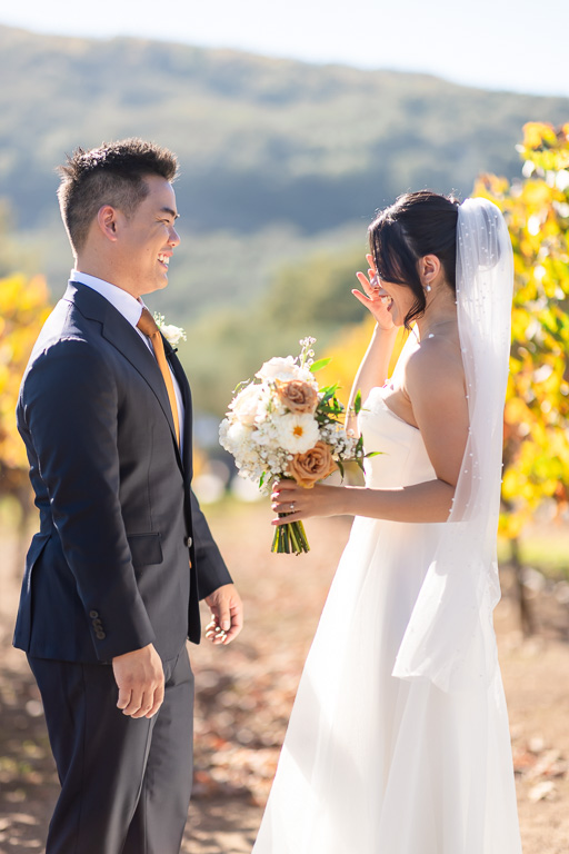 bride wiping away a tear during their first look