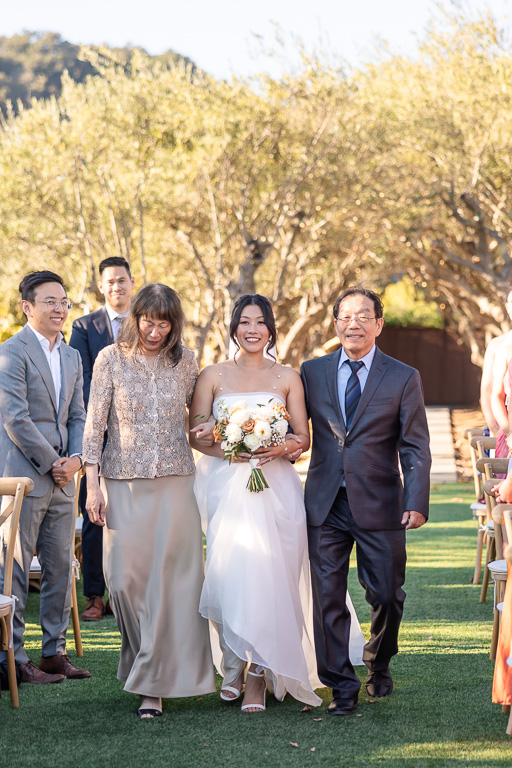 bride escorted by parents