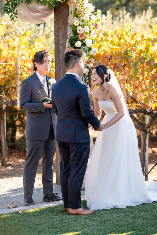 bride laughing during the wedding ceremony