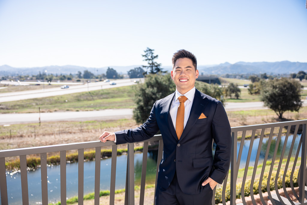 groom on a balcony in Morgan Hill