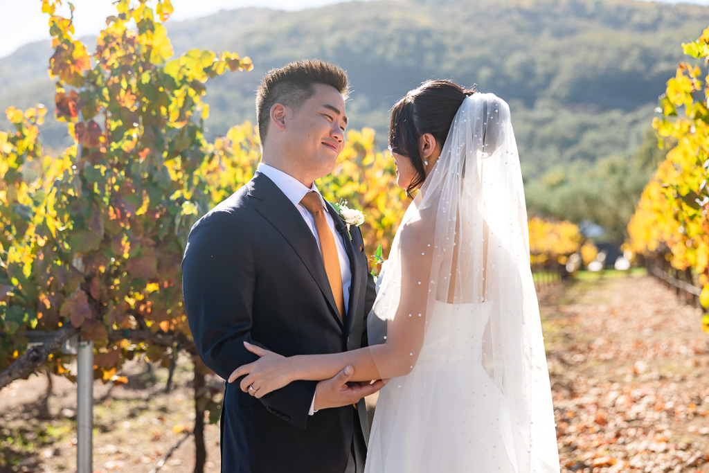 groom looking at his bride lovingly during the first look
