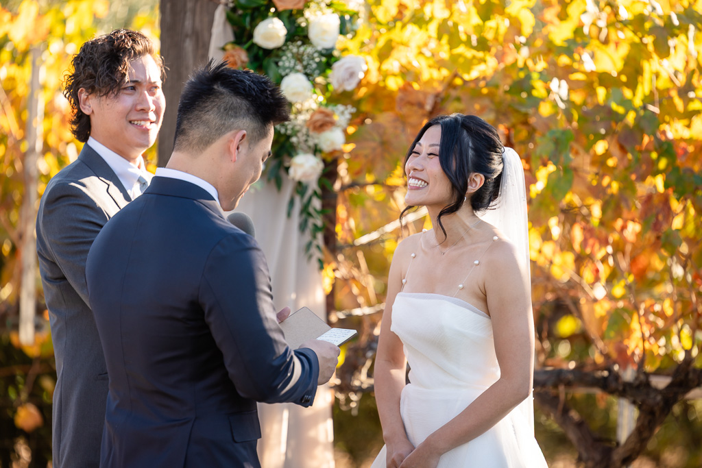 a cute shot of the bride smiling during the ceremony