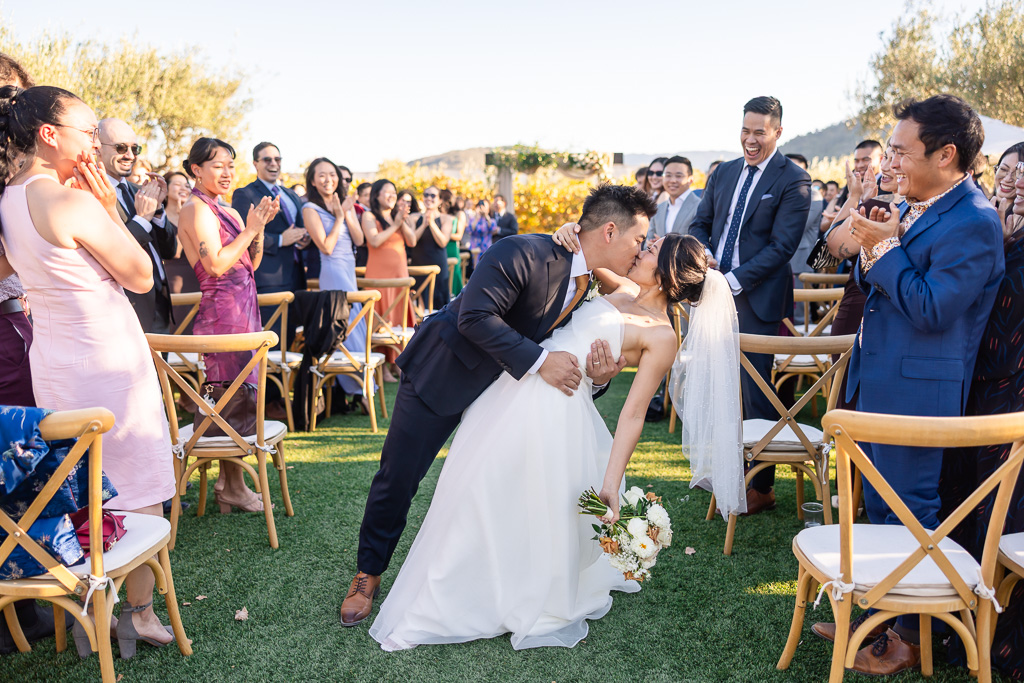 dip & kiss at the end of the aisle