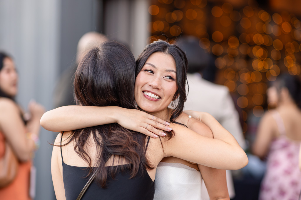 the bride hugging her friend