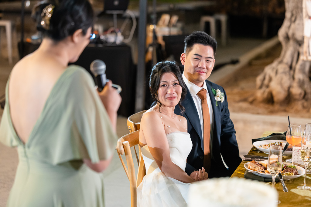 bride crying as bridesmaid gives emotional speech