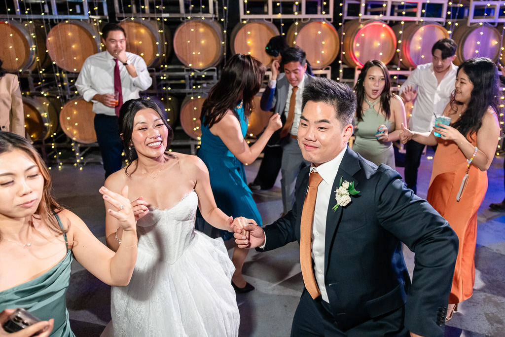 bride and groom at the center of the dance floor in the barrel room at MOHI Ranch