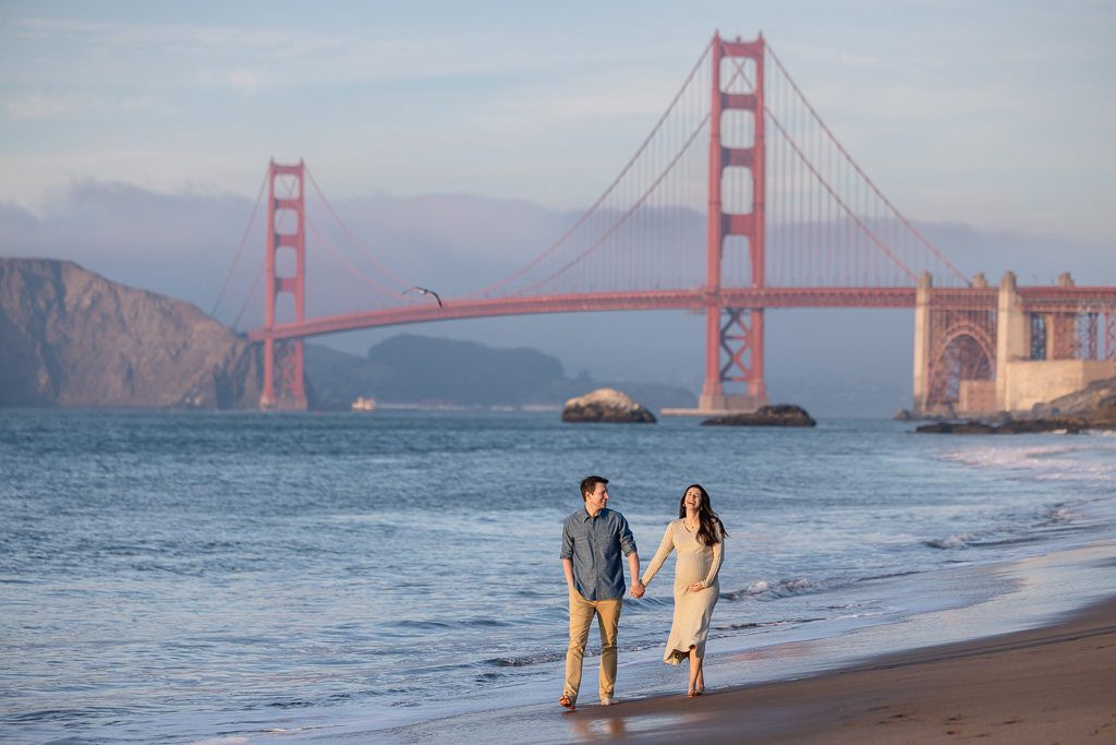 husband and wife maternity photos by the Golden Gate Bridge