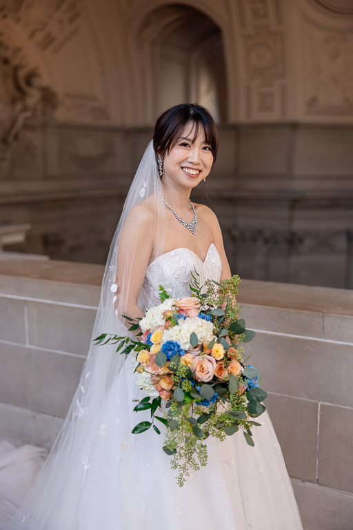 bride solo with floral bouquet at San Francisco City Hall