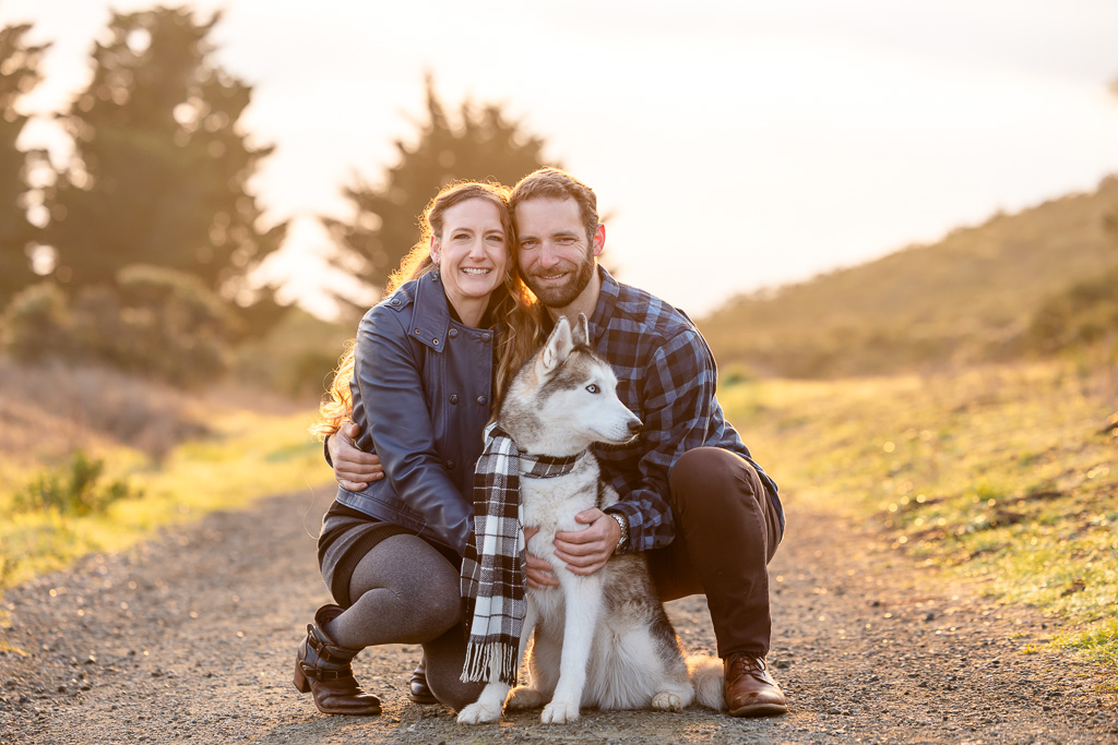 golden hour portrait of couple and dog