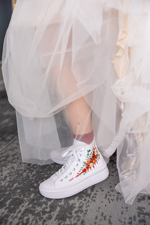 bride wearing special colorful wedding shoes