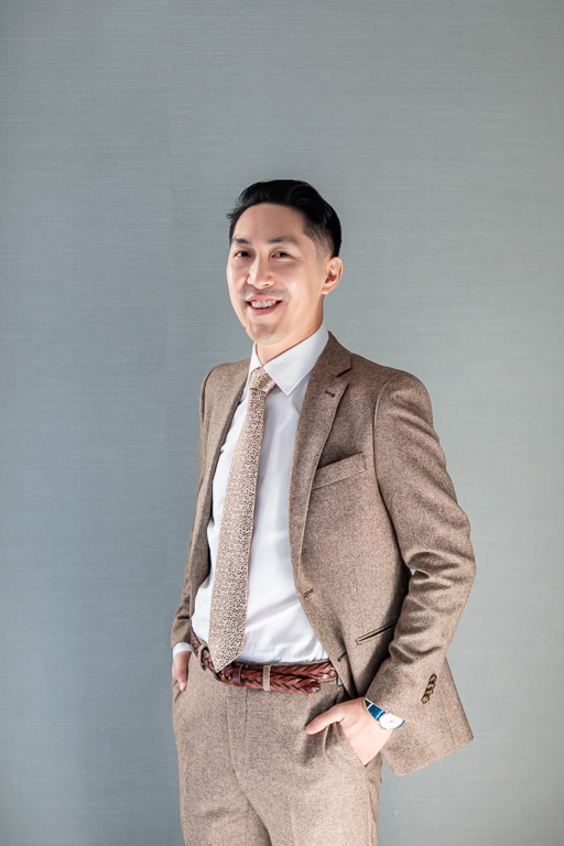 clean portrait of groom by himself getting ready