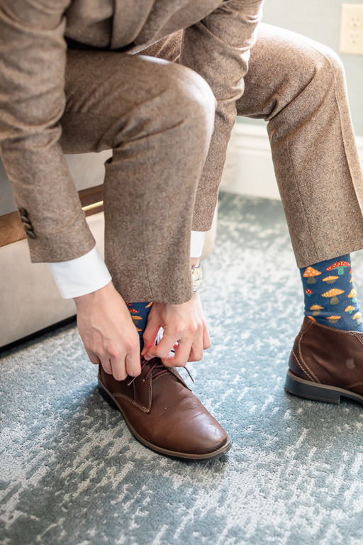 groom putting on shoes