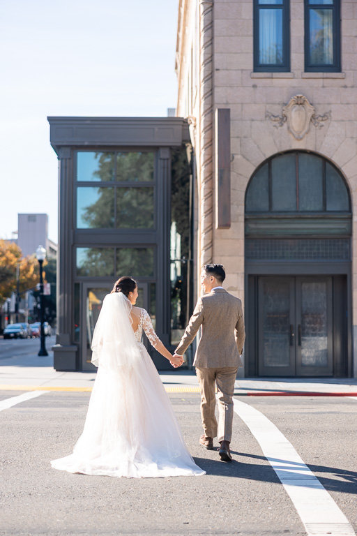 natural, organic wedding photo crossing the street in downtown Sacramento
