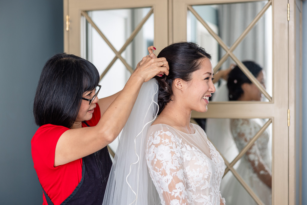 aunt helping do the bride's hair
