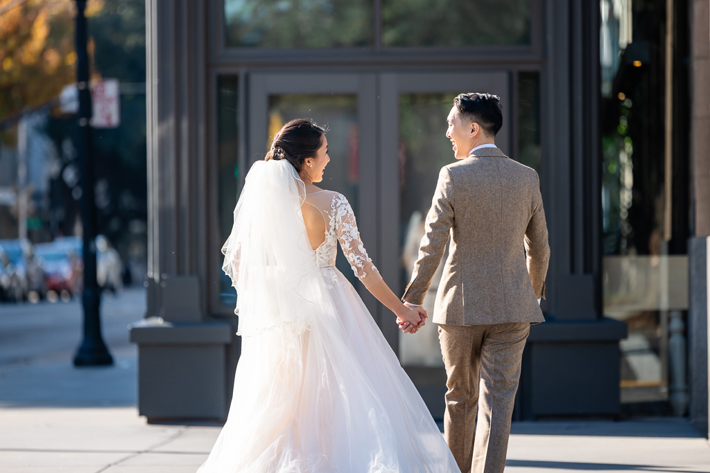 candid street photo of newlyweds in Sacramento