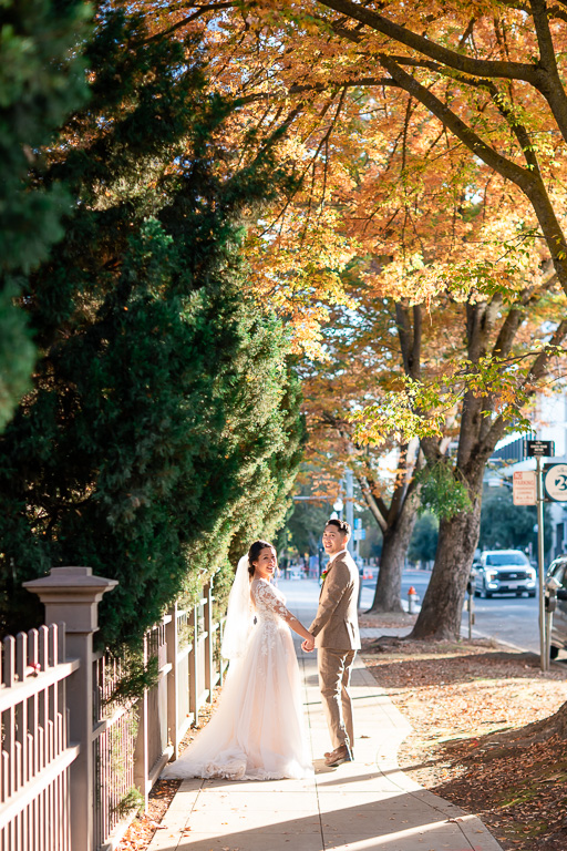 wedding photo with colorful fall leaves in Sacramento