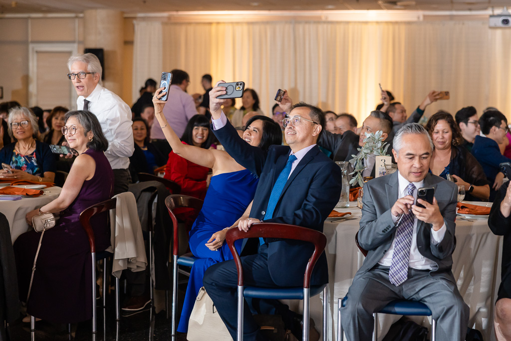 wedding guests taking phone photos