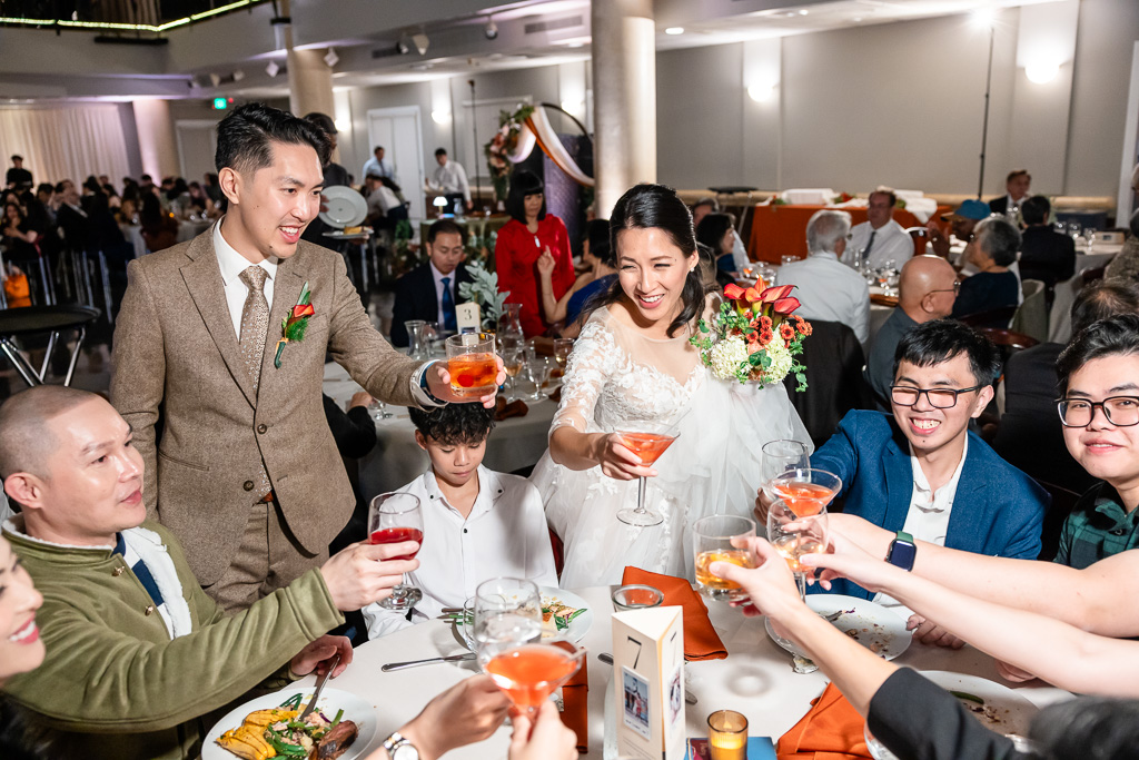 the groom and bride making rounds at the tables