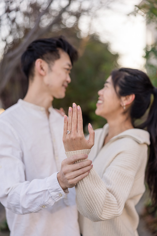 showing off the new engagement ring