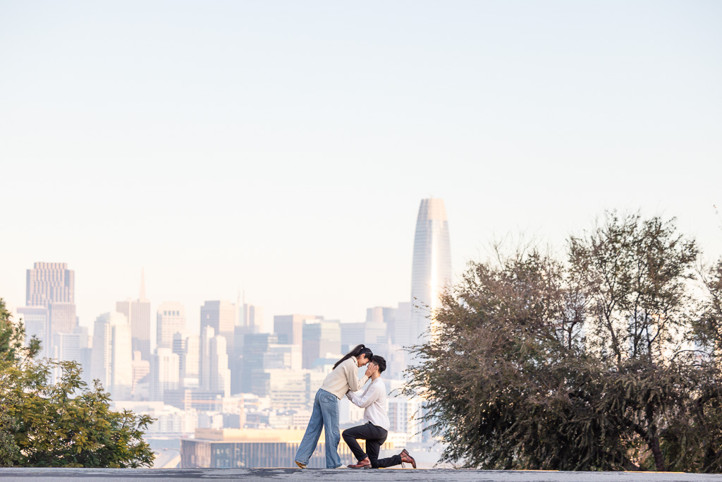 surprise proposal with the San Francisco city skyline in the background