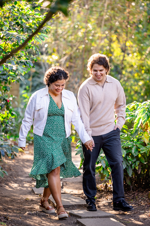 natural, candid engagement photos in the woods on a sunny afternoon day