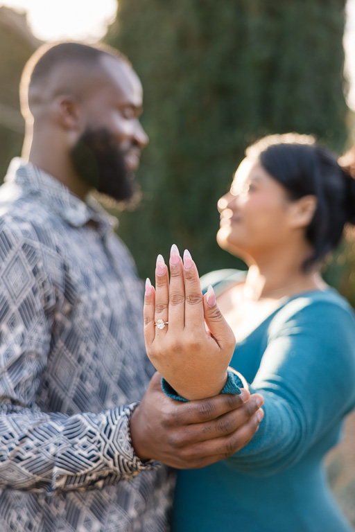 showing off engagement ring