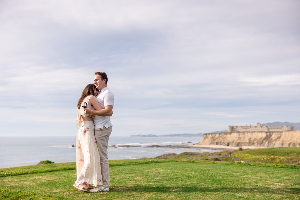 intimate moment of couple hugging on the ocean bluffs