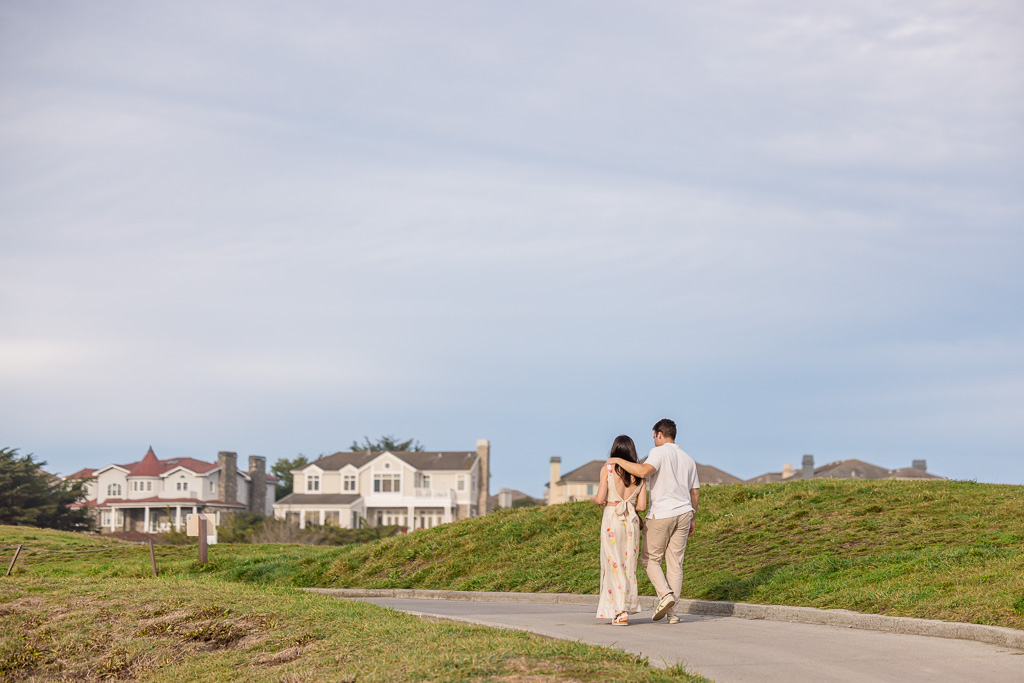 couple walking towards the Ritz-Carlton Half Moon Bay