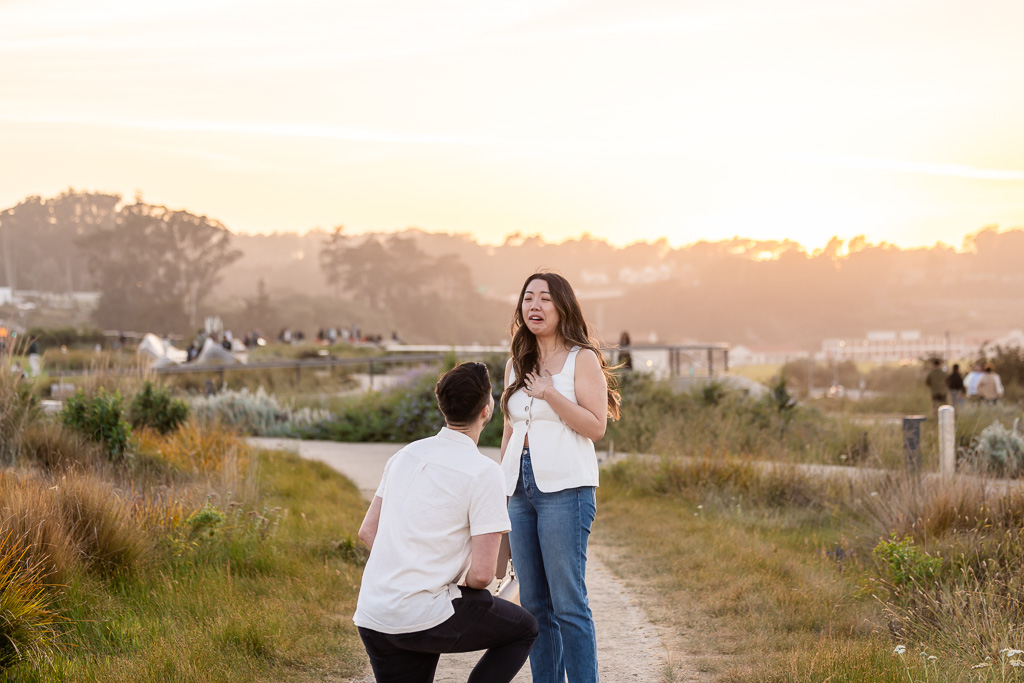 cute reaction to kneeling down for surprise proposal