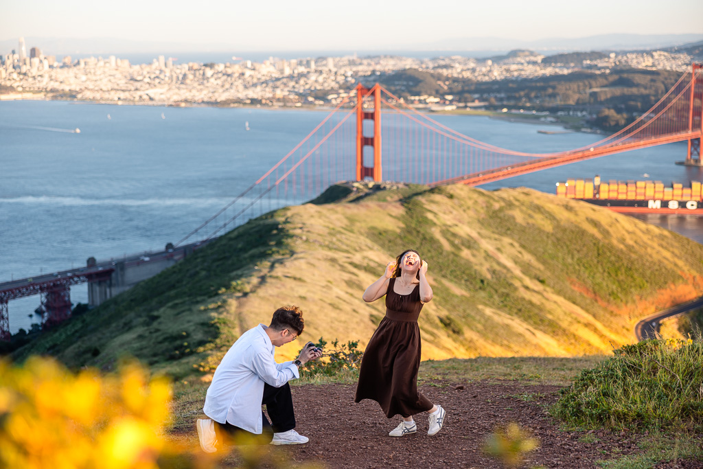 amazingly surprised reaction to proposal on a hillside